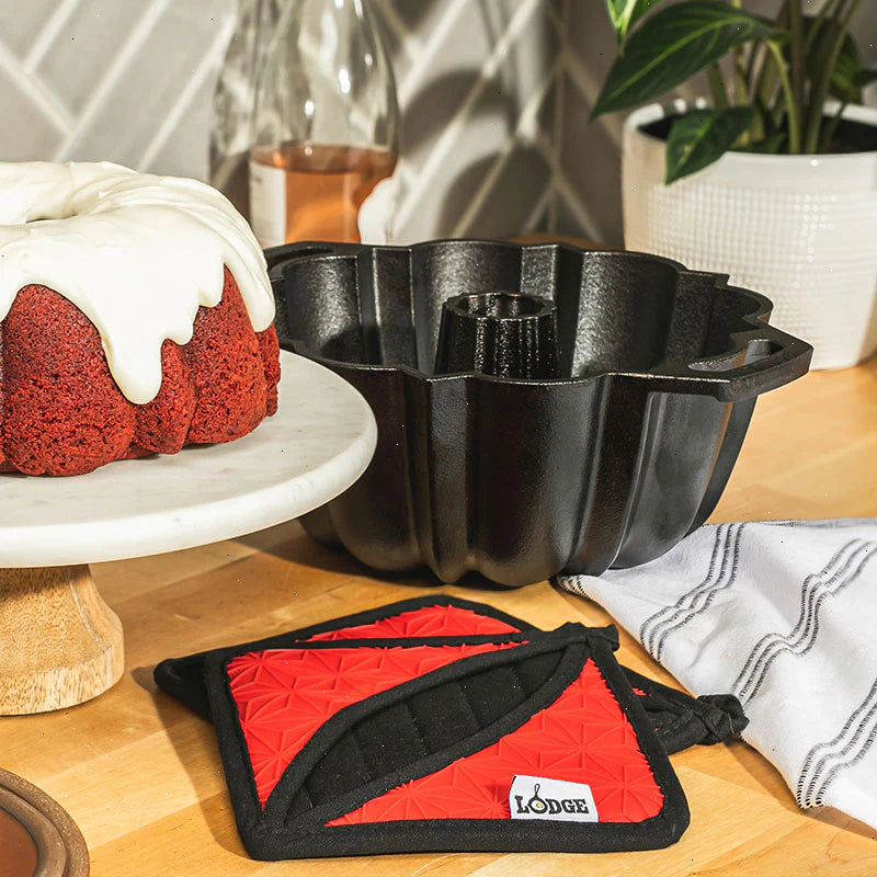 Cast Iron Fluted Cake Pan with Red Potholders - View 3